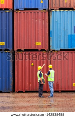 shipping company workers counting containers at depot