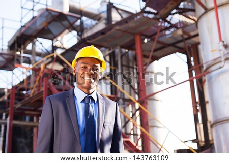 happy african american chemical industry manager in plant