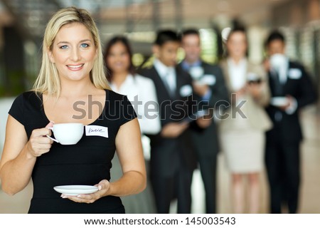 attractive young businesswoman coffee break during conference