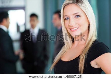 beautiful young businesswoman closeup portrait in office