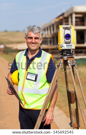 happy senior land surveyor portrait outdoors