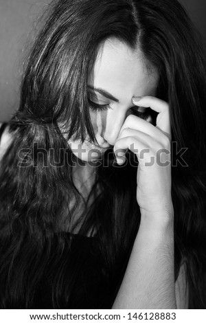 sad young woman looking down