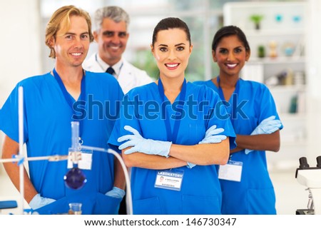 cheerful medical researchers in lab