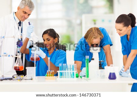 group of medical researchers working in lab