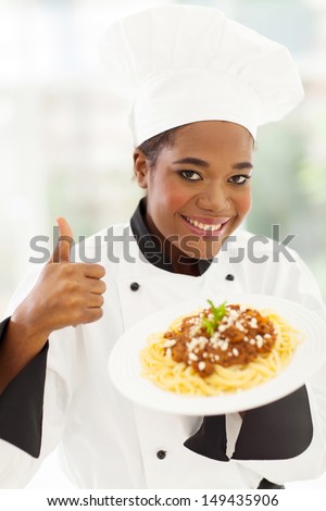 smiling female african american chef giving thumb up