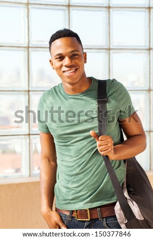 handsome african american boy with a bag