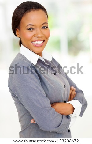 attractive afro american woman with arms folded looking at the camera