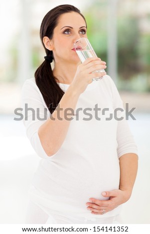 healthy pregnant woman drinking water