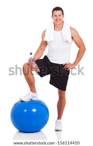 smiling muscular man with water bottle and fitness ball on white background smiling muscular man with water bottle and fitness ball on white background