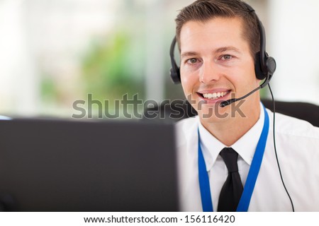 Smiling Male Customer Support Operator With Headset