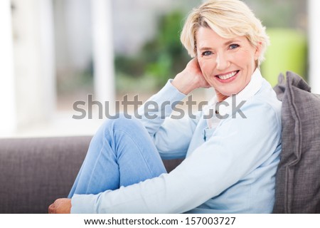 attractive middle aged woman relaxing at home