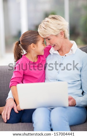 happy granddaughter hugging her senior grandmother