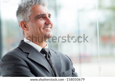 close up portrait of senior businessman looking up