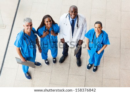 overhead view of group healthcare workers looking up