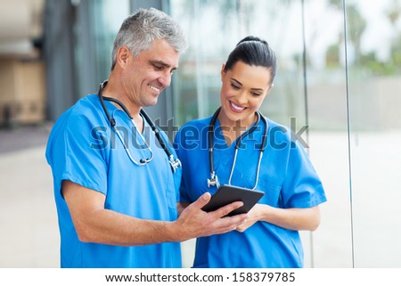 professional healthcare workers using tablet computer