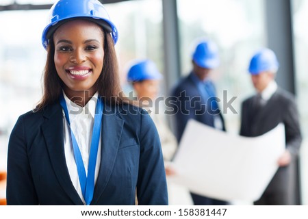 beautiful african female construction worker looking at the camera