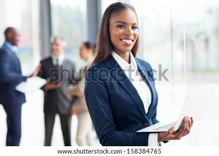 Smiling African Businesswoman With Laptop Computer