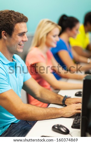 group of young college students using computers