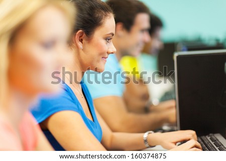group of university students using computer in computer lab