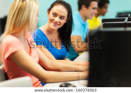 female college friends talking in computer room
