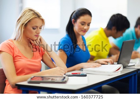 university students studying in classroom