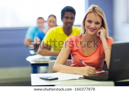 cheerful group of university students in lecture room