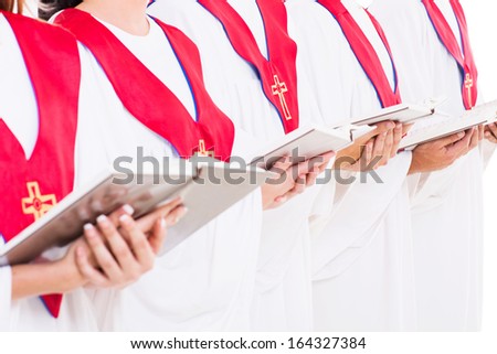 close up portrait of church choir holding hymn books