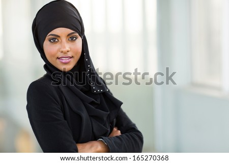 beautiful modern arabic office worker portrait with arms crossed