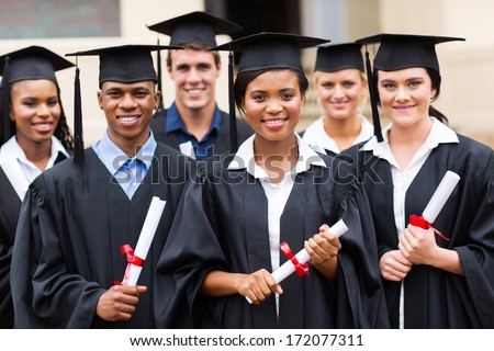 Portrait Of Multiracial Graduates Holding Diploma