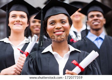 optimistic young university graduates at graduation optimistic young university graduates at graduation