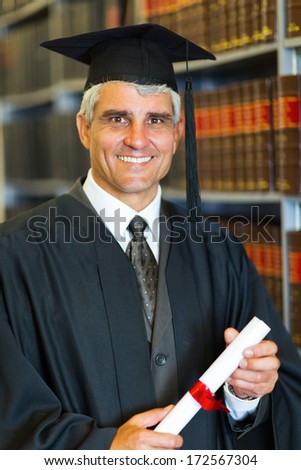 cheerful mid age male law school graduate holding diploma