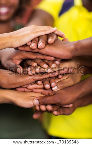 group of african students hands together closeup