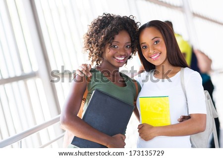 pretty african american college friends together on campus