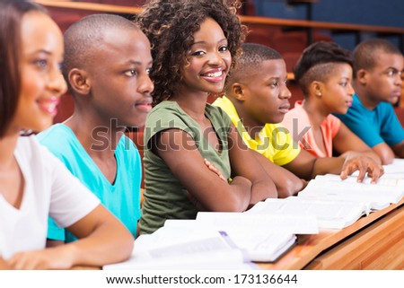 group of african college students studying together in lecture hall