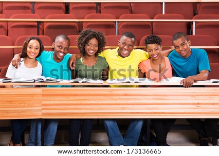 group of happy african college friends in lecture hall