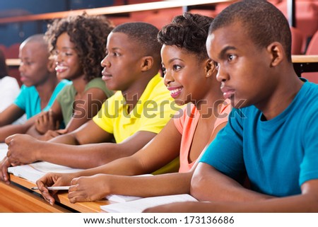 group of african american university students studying in lecture hall
