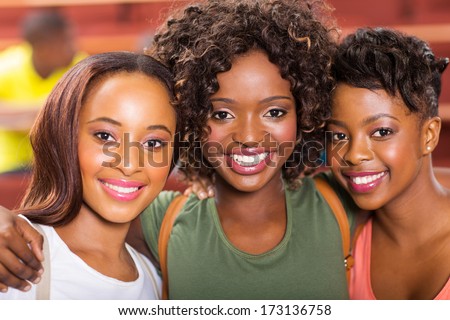 three african college friends closeup portrait