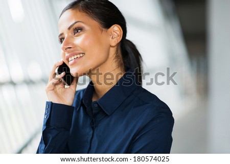 beautiful office worker talking on cell phone
