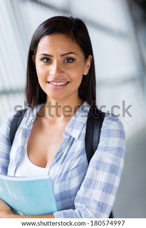 smiling female university student looking at the camera