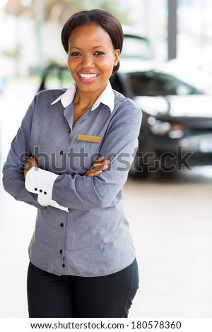 beautiful african woman working at car dealership