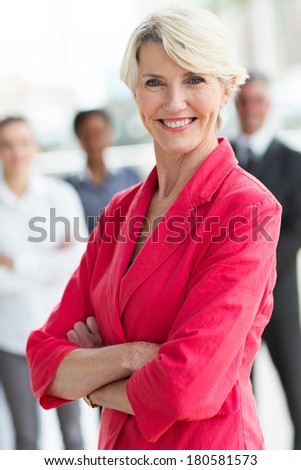 beautiful middle aged businesswoman with arms crossed