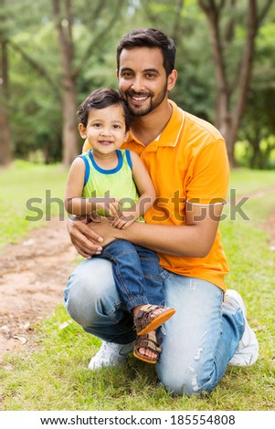 happy indian father and son outdoors in forest happy indian father and son outdoors in forest