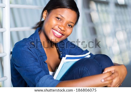 attractive african american woman with books