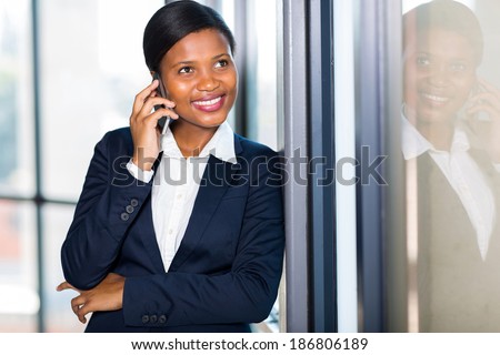 beautiful afro American businesswoman talking on a cell phone