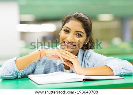 cute female college student in library