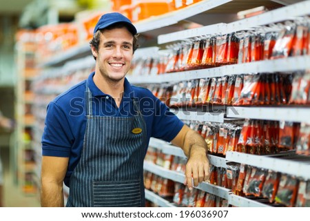 happy hardware store worker looking at the camera