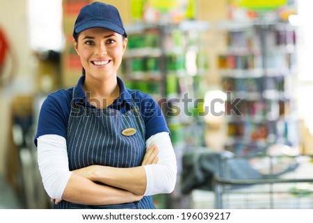 pretty hardware store employee looking at the camera