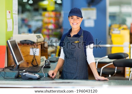 beautiful woman working as a cashier at the supermarket
