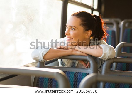 pretty female commuter daydreaming on bus