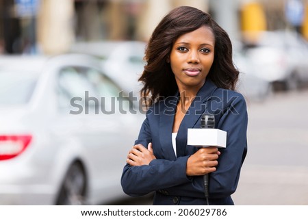 attractive young african female news reporter